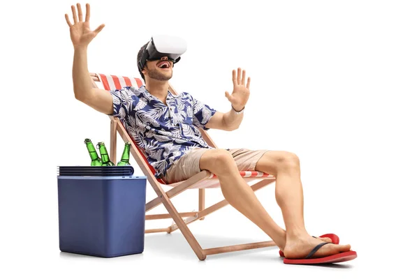 Guy in a deck chair using a VR headset — Stock Photo, Image