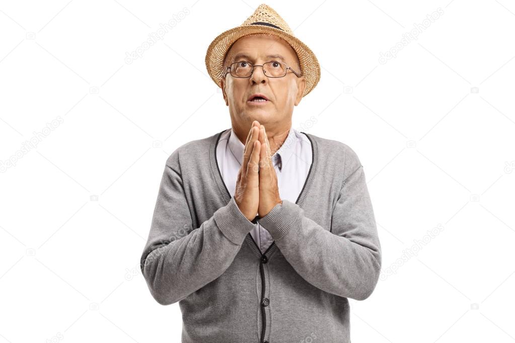 Mature man praying