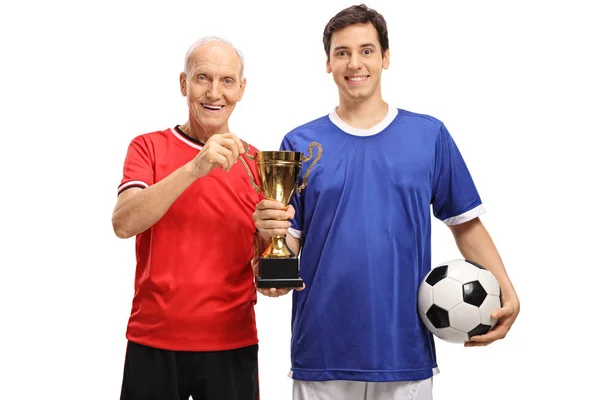 Two players holding golden trophy — Stock Photo, Image