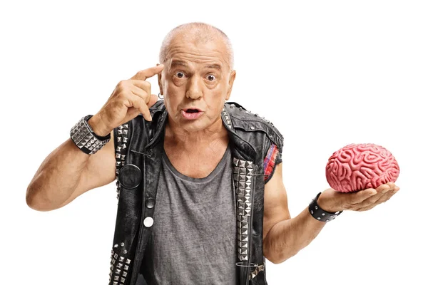 Punker with brain model holding finger on his temple — Stock Photo, Image