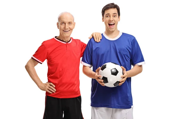 Elderly and young soccer players with football — Stock Photo, Image