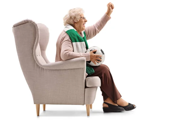 Excited woman with a scarf and a football cheering — Stock Photo, Image