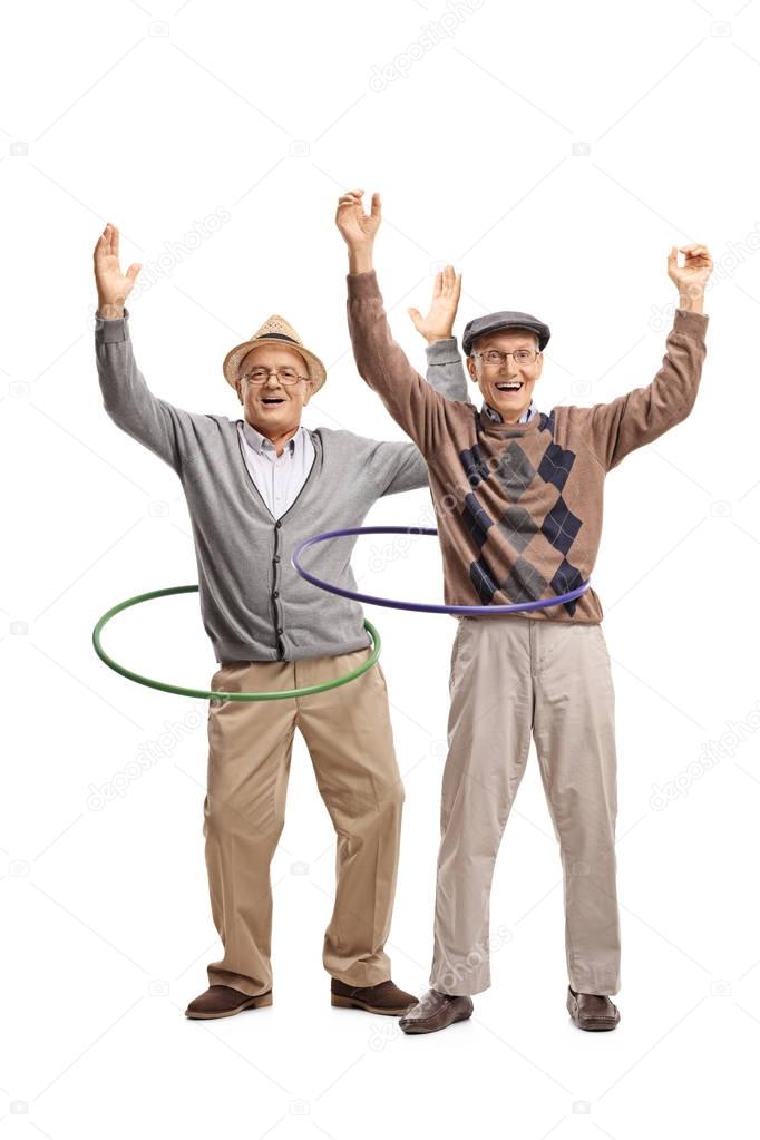 cheerful elderly men with hula hoops