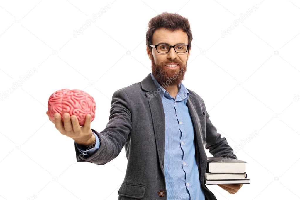 Professor with books and a brain model