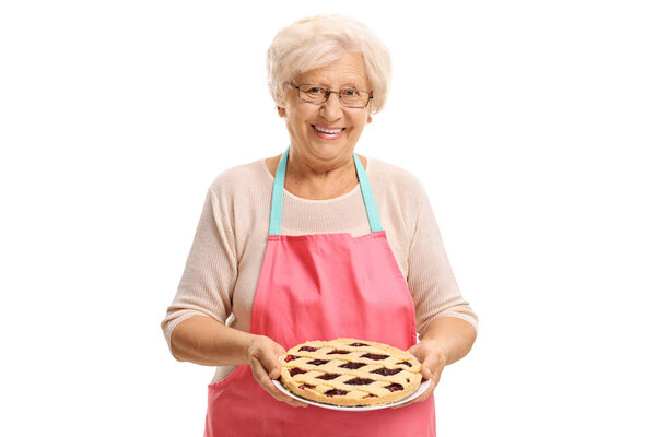 Elderly woman with freshly baked pie