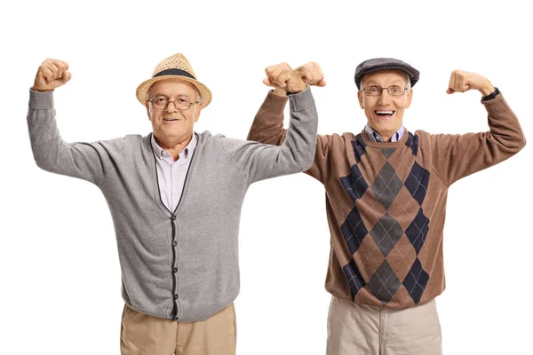 Ancianos flexionando sus bíceps — Foto de Stock