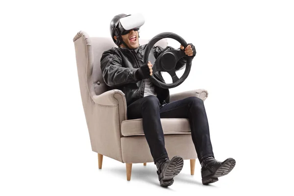 Biker met behulp van een Vr headset ingedrukt te houden een stuurwiel — Stockfoto