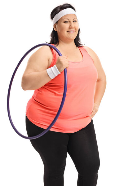 Overweight woman holding a hula-hoop