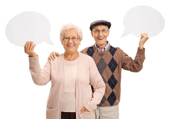 Seniors with speech bubbles — Stock Photo, Image