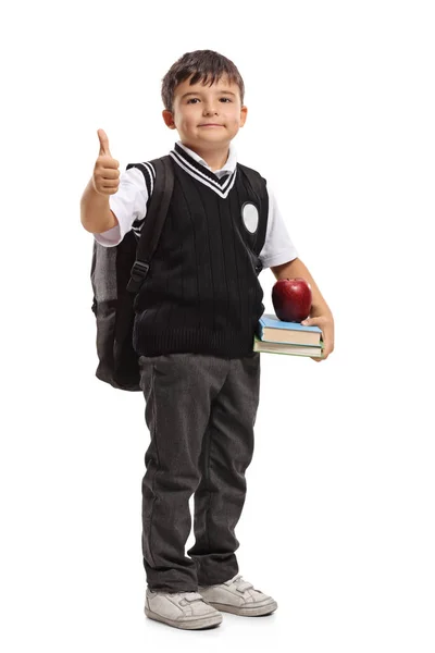Pequeno estudante fazendo um gesto polegar para cima — Fotografia de Stock