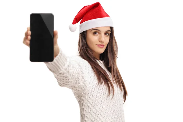 Girl wearing a christmas hat and showing a phone — Stock Photo, Image