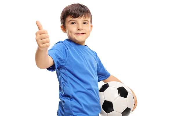 Menino segurando futebol e fazendo polegar para cima sinal — Fotografia de Stock