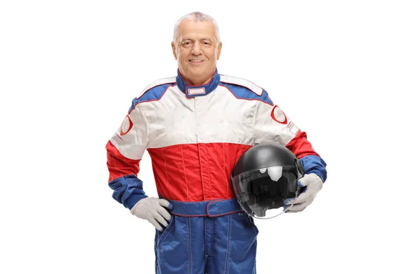 Man in a racing suit holding a helmet — Stock Photo, Image