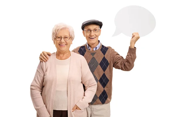Senior couple with a chat bubble — Stock Photo, Image
