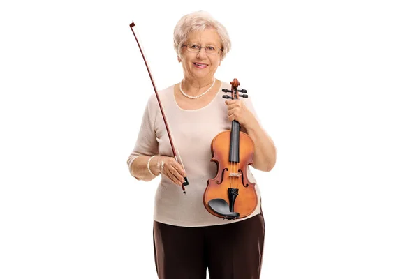 Mature woman with a wand and a violin — Stock Photo, Image