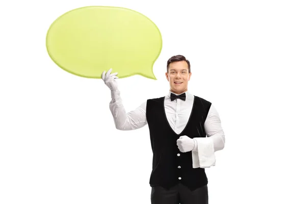 Waiter holding a yellow speech bubble — Stock Photo, Image