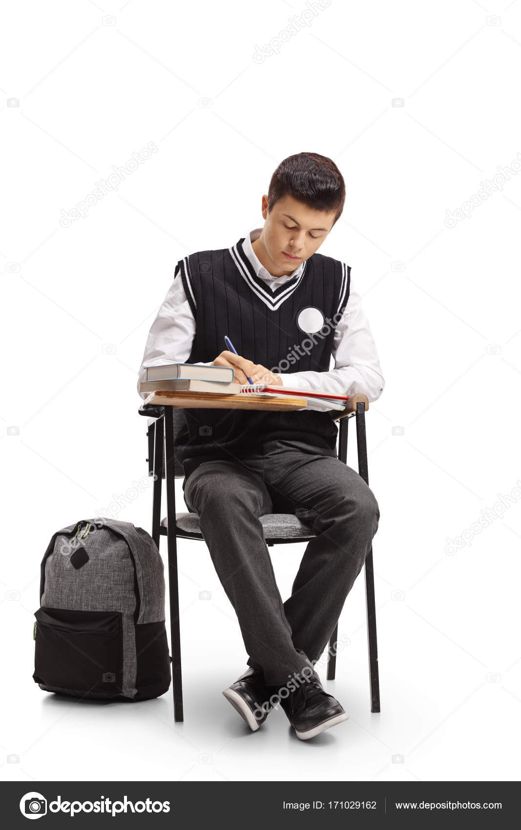 Student sitting in a school chair and taking notes Stock Photo by  ©ljsphotography 171029162