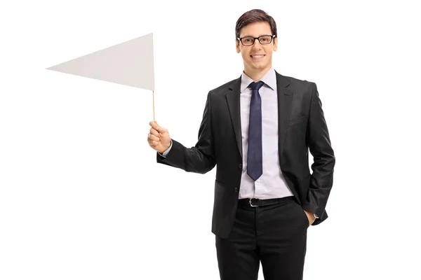 Young businessman holding a white flag — Stock Photo, Image