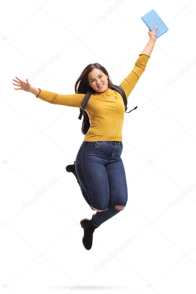 female student jumping and gesturing happiness