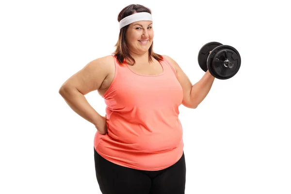 Cheerful overweight woman with a dumbbell — Stock Photo, Image