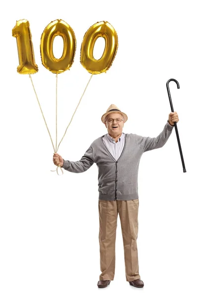 Senior with a number hundred balloon and a cane — Stock Photo, Image