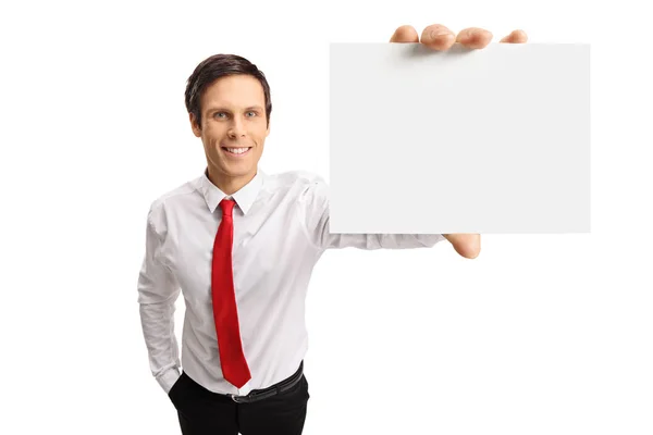 Young businessman showing a blank card — Stock Photo, Image