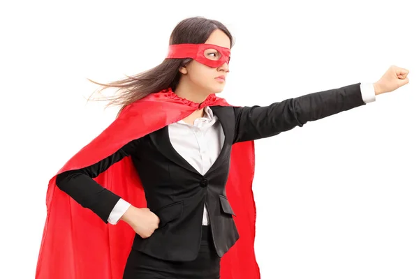 Superhéroe femenino sosteniendo su puño en el aire — Foto de Stock