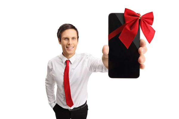 Ragazzo mostrando un telefono avvolto con un nastro come un regalo — Foto Stock