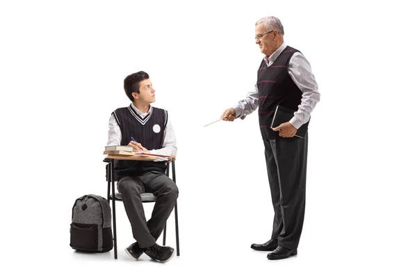 Teenage student looking at his professor — Stock Photo, Image