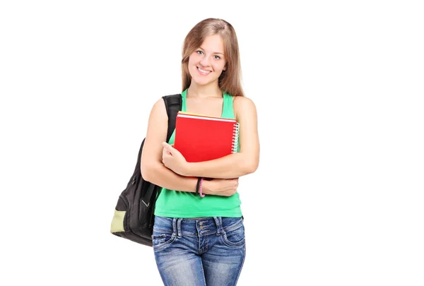 Schoolgirl with a backpack and books — Stock Photo, Image