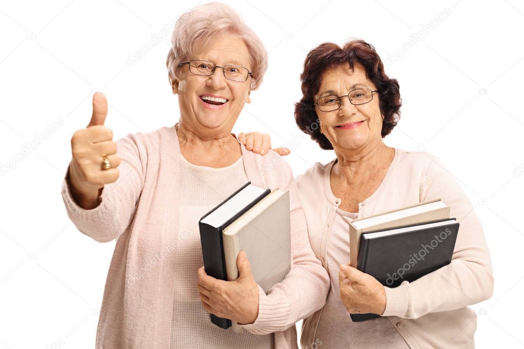 women with books making a thumb up gesture