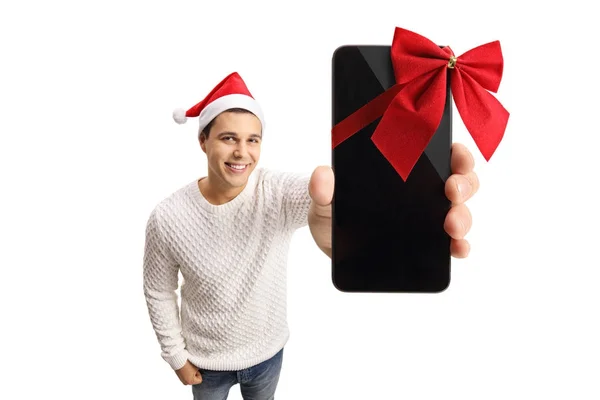 Homem com um chapéu de Papai Noel mostrando um telefone com fita — Fotografia de Stock