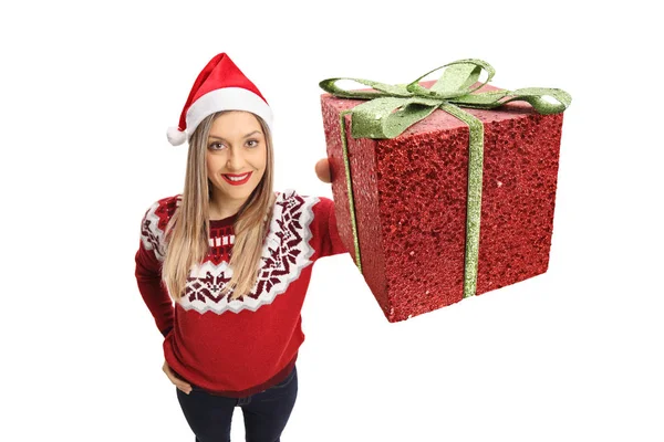 Woman wearing a christmas showing a present — Stock Photo, Image