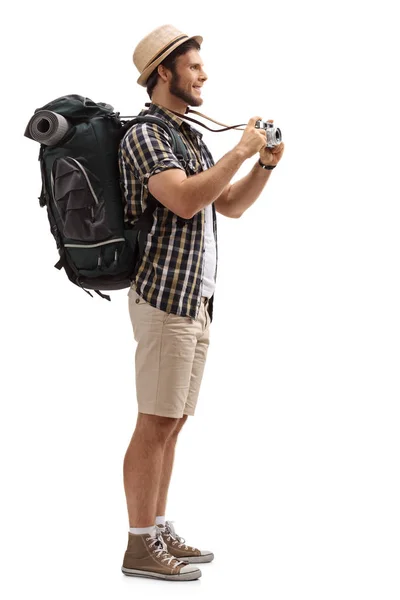 Tourist with a backpack and a camera — Stock Photo, Image