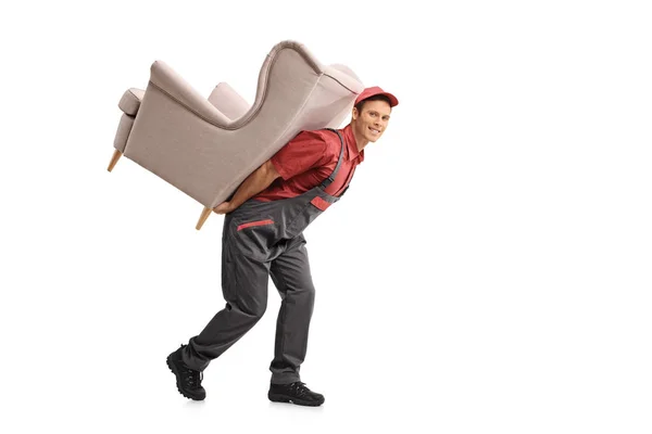 Mover llevando un sillón en su espalda — Foto de Stock