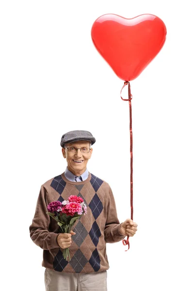 Adam bir çiçek buketi ve kalp şekilli balon — Stok fotoğraf