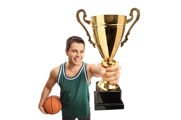 Basketball player showing a gold trophy — Stock Photo, Image