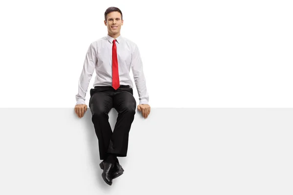 Formally dressed guy sitting on a panel — Stock Photo, Image