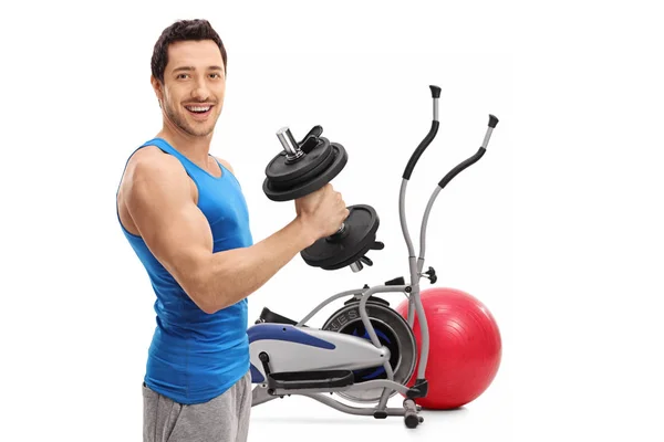 Young man exercising with a dumbbell — Stock Photo, Image