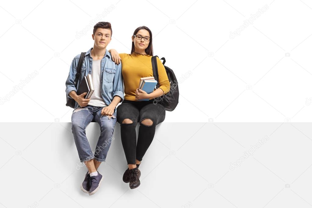 Teenage students sitting on a panel
