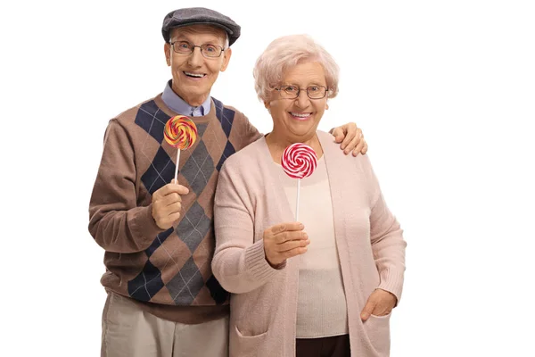 Casal de idosos com pirulitos — Fotografia de Stock