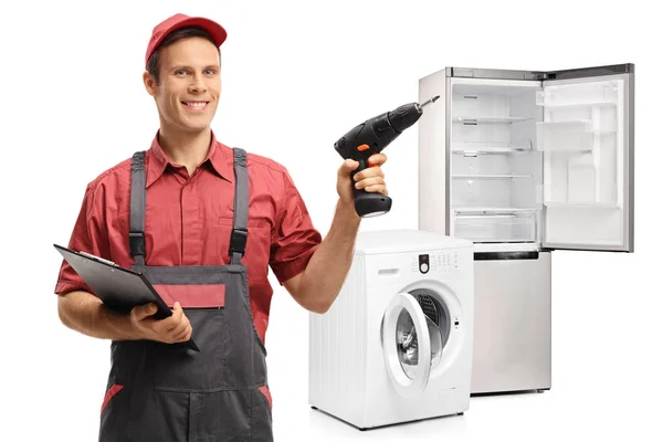 Reparateur met een Klembord en een boren machine — Stockfoto