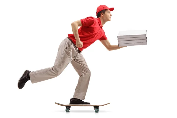 Pizza delivery boy with pizza boxes riding a skateboard — Stock Photo, Image
