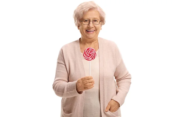 Joyful äldre kvinna med en slickepinne — Stockfoto