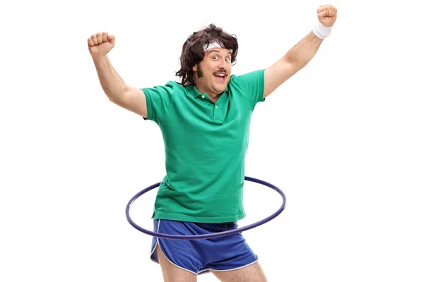 Retro sportsman exercising with a hula hoop — Stock Photo, Image