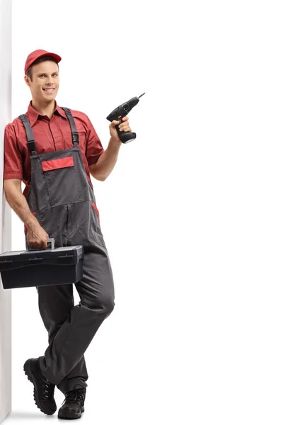 Reparatør med en værktøjskasse og en boremaskine - Stock-foto