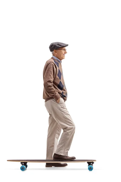 Senior with a longboard waiting in line — Stock Photo, Image