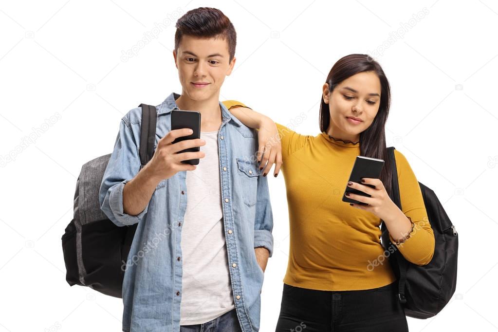 Teenage students using phones