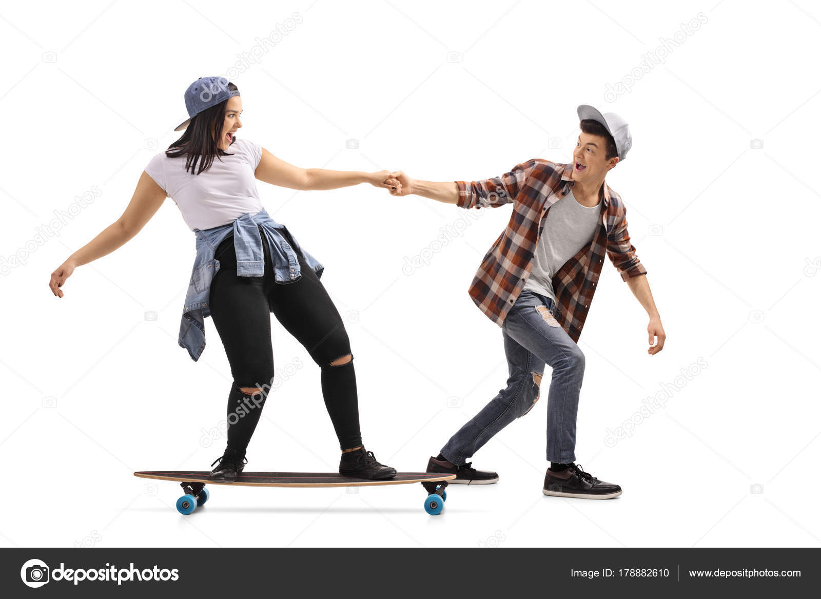 Boy pulling a girl on a longboard — Stock Photo © ljsphotography 178882610