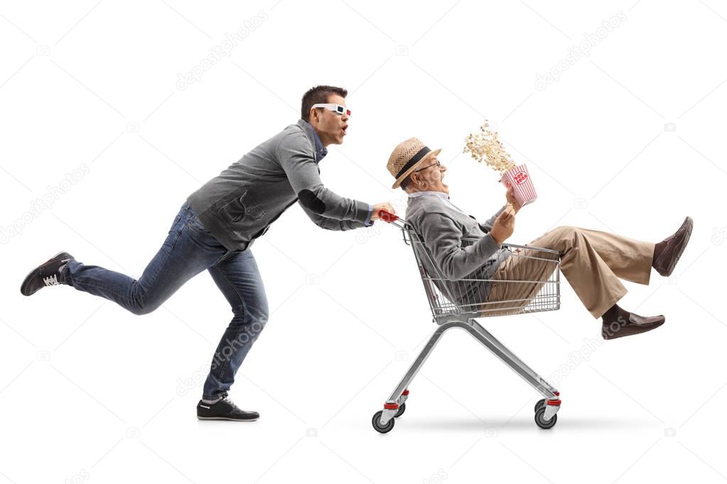 man pushing a shopping cart with man 